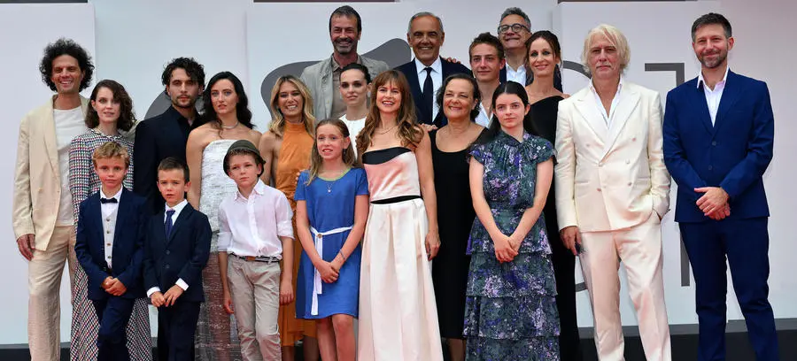 Italian filmmaker Maura Delpero (C) poses with cast and producers as she arrives for the premiere of 'Vermiglio' during the 81st Venice Film Festival in Venice, Italy, 02 September 2024. The movie is presented in official competition 'Venezia 81' at the festival running from 28 August to 07 September 2024. ANSA/ETTORE FERRARI