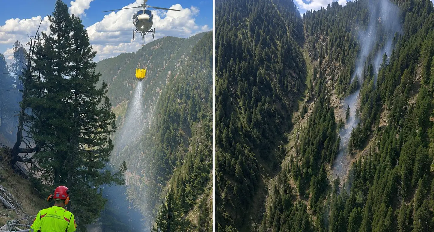 Incendio boschivo sopra Val di Giovo, vigili del fuoco al lavoro con due elicotteri
