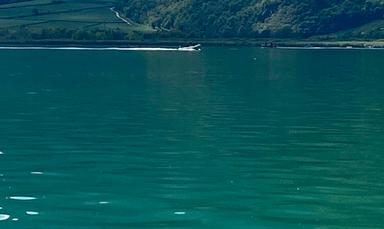 Caldaro, Sup abbandonato in acqua: si cerca un uomo