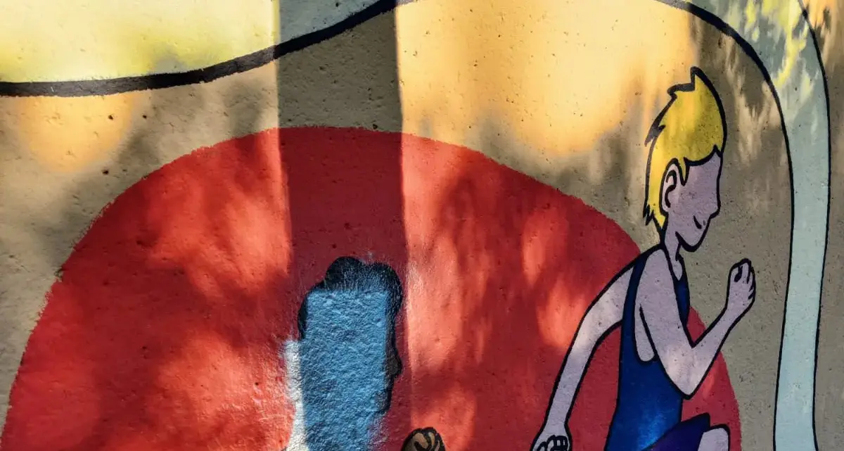 Bolzano, imbrattato il murale di Don Bosco: l’Anpi «Basta razzismo»