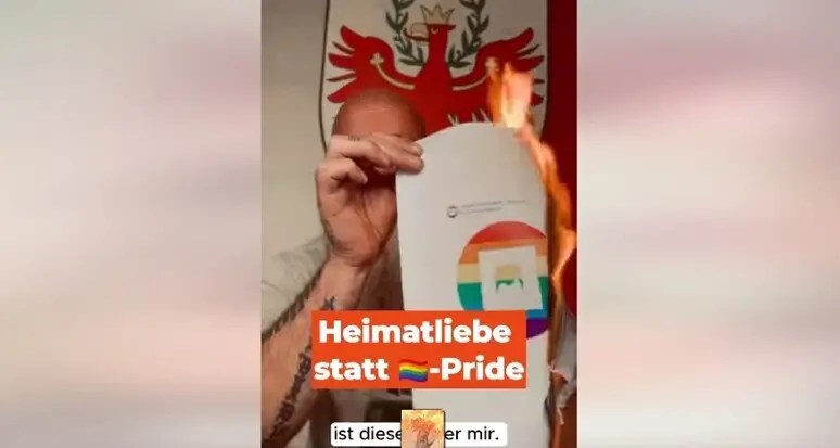 Wirth Anderlan brucia un foglio con la bandiera arcobaleno